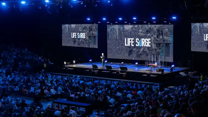Live event stage view of Life Surge Oklahoma City 2025 with speaker