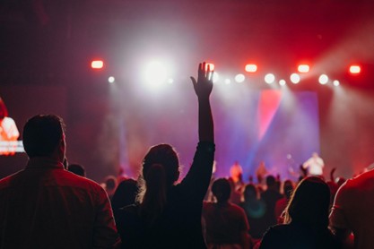 Attendees worship during Life Surge Portland, a one-day Christian event focused on worship, wisdom, work, and wealth