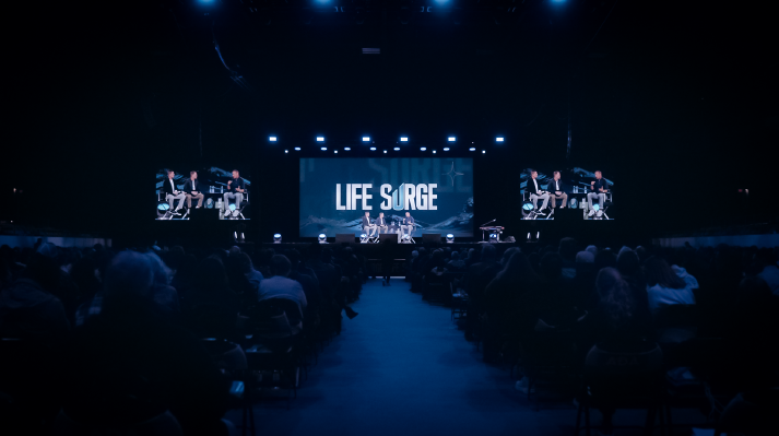 ife Surge Albuquerque event – thousands worship together during main session with speakers on stage